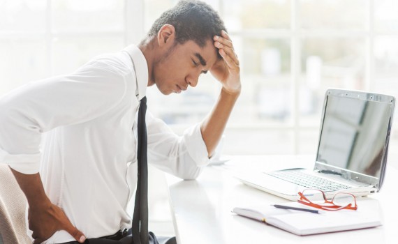 back-pain-desk-poor-posture-black-man-1465293658